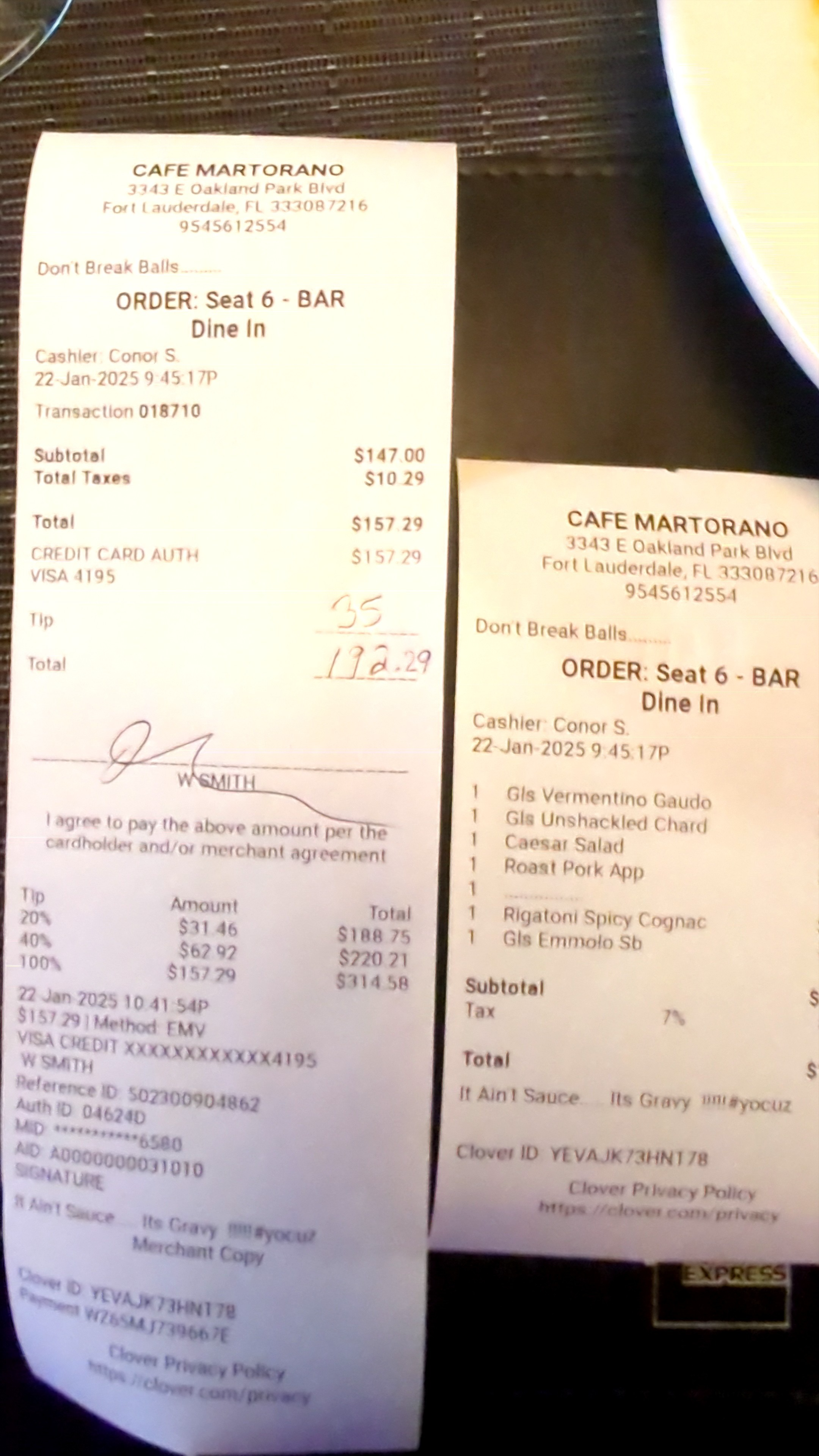 Itemized receipt next to credit card slip